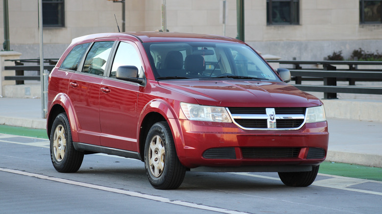 A red Dodge Journey parked