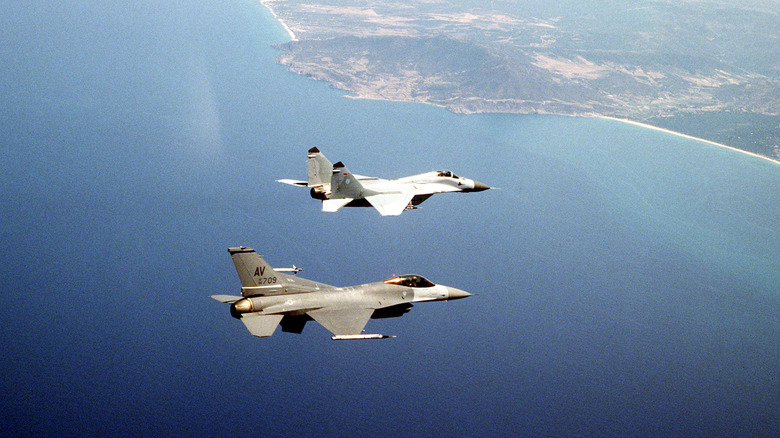 ﻿﻿A U.S. F-16 and a German MiG-29 fly together during a NATO exercise off the coast of Sardinia, Italy.