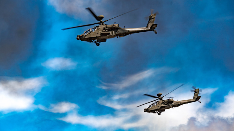 A pair of AH-64 helicopters in the sky