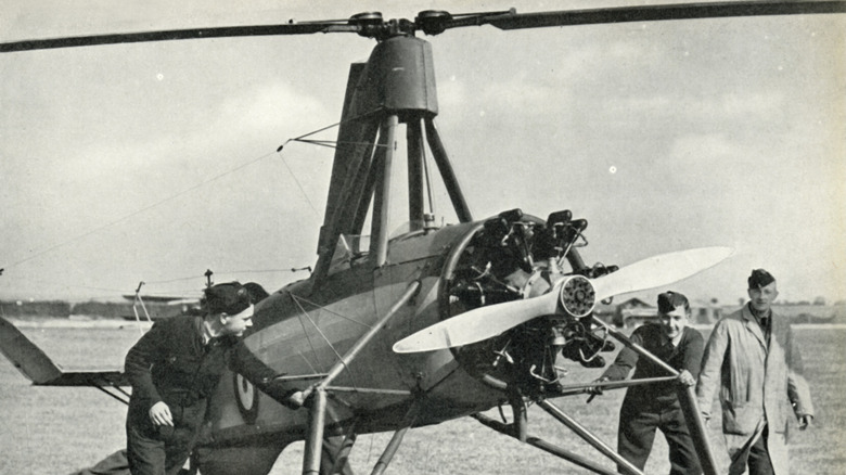 Avro 261 on ground being inspected by military personnel