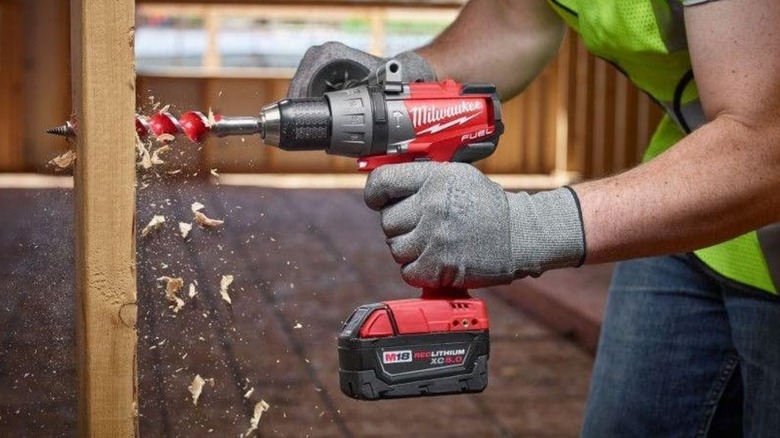 Person using Milwauke drill