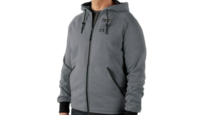 A person wearing a Milwaukee heated hoodie.