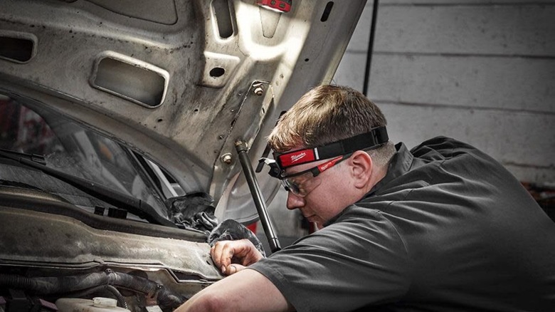 person with Milwaukee headlamp