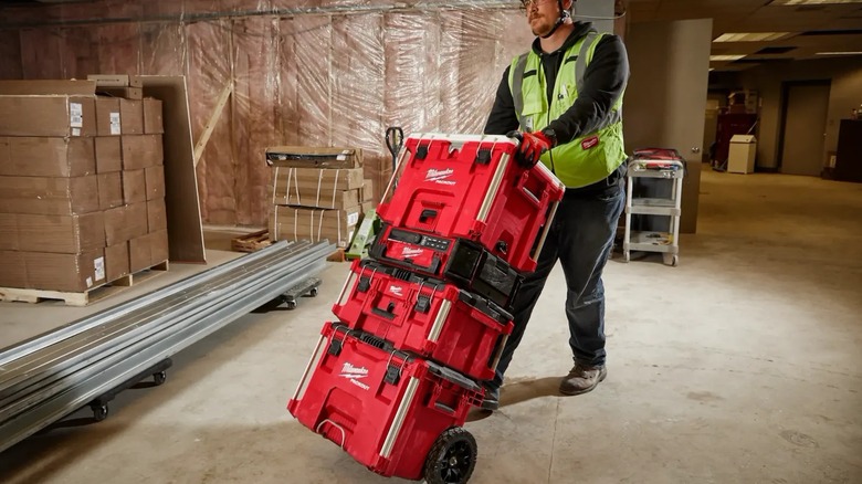builder pushing a Milwaukee Packout stack