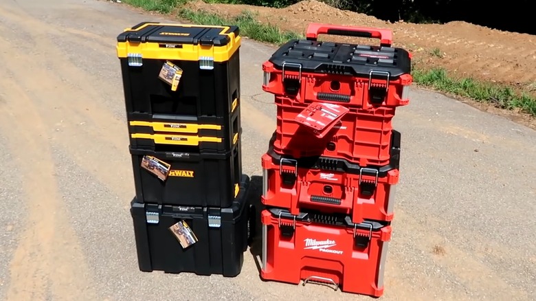 dewalt toughsystem and milwaukee packout modular tool storage systems next to each other