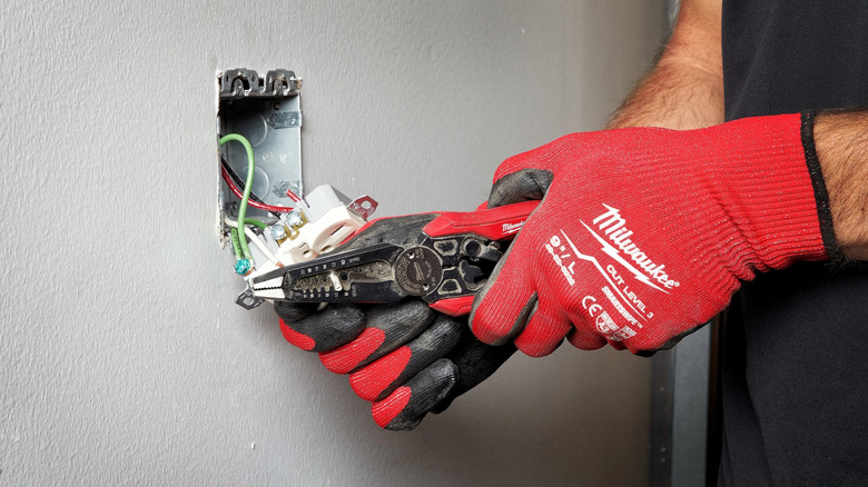 person using Milwaukee 7-in-1 Combination Wire Strippers Pliers