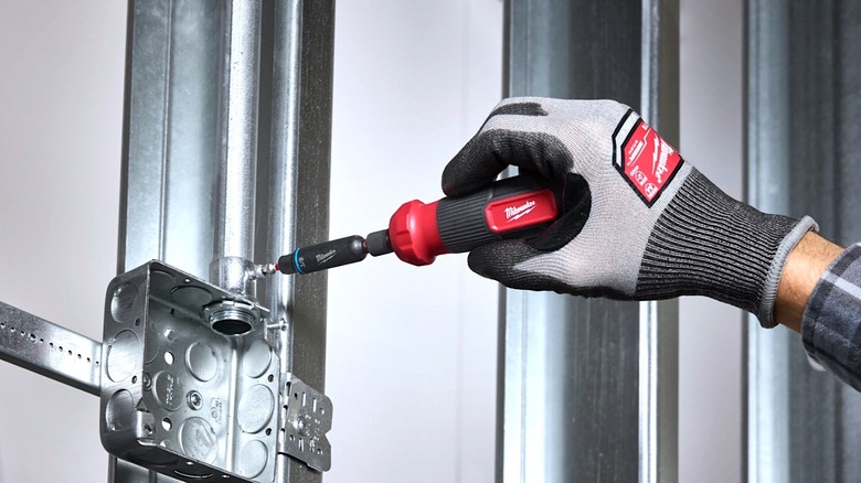 Person using Milwaukee's Shocwave Impact Screwdriver