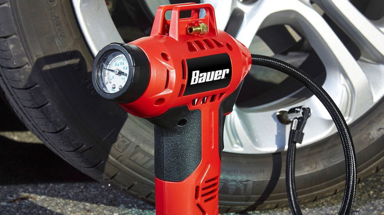 bauer cordless inflator connected to tire