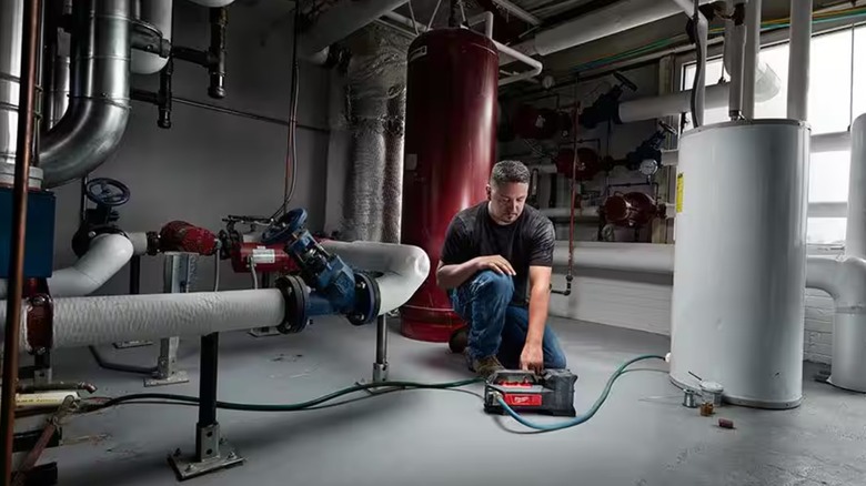Milwaukee Transfer Pump attached to a water heater