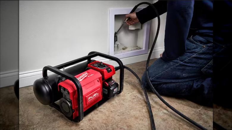 Milwaukee M18 Fuel 2-gallon Compact Quiet Compressor in use