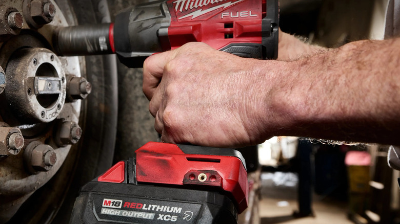 A closeup of the Milwaukee M18 XC5 Resistant battery on a drill