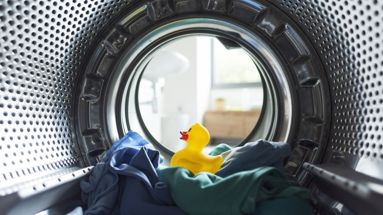 Clothes and a rubber duck in a dryer