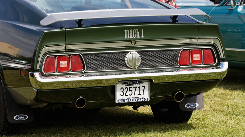 Rear view of green Mustang Mach 1 with Minnesota collector plate.