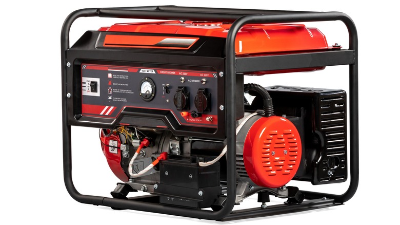 Black and red generator unit with white background