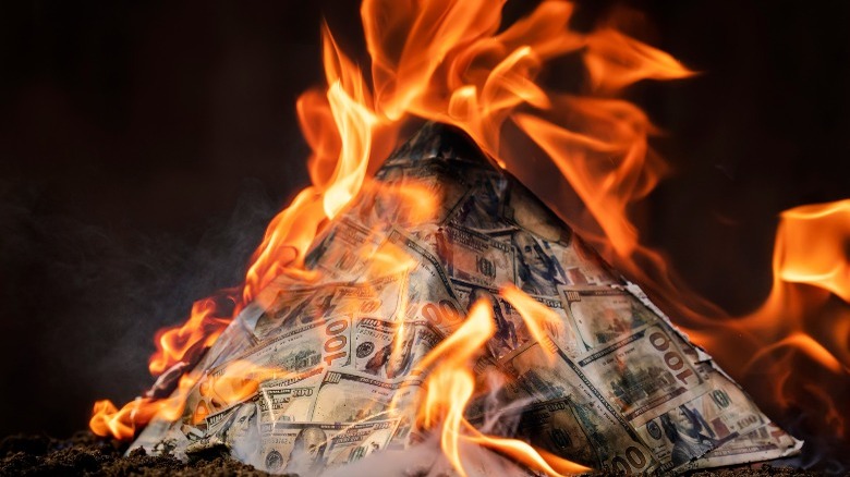 Pile of money burning
