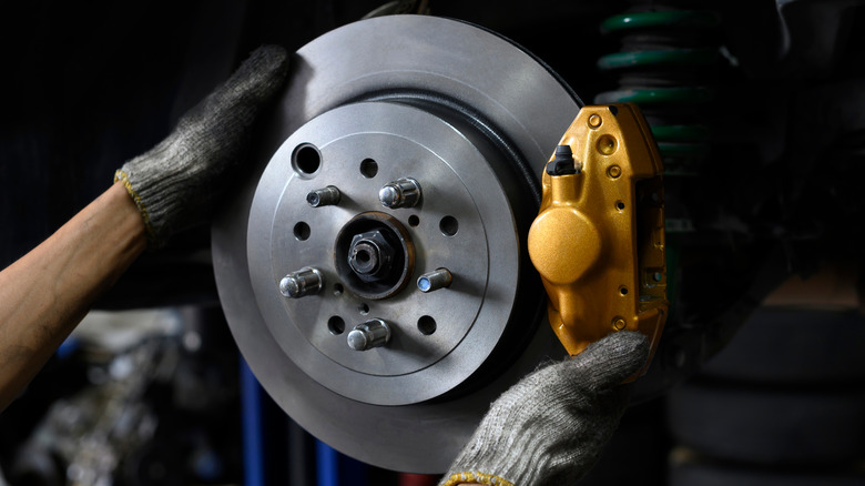 Mechanic hands brake rotors