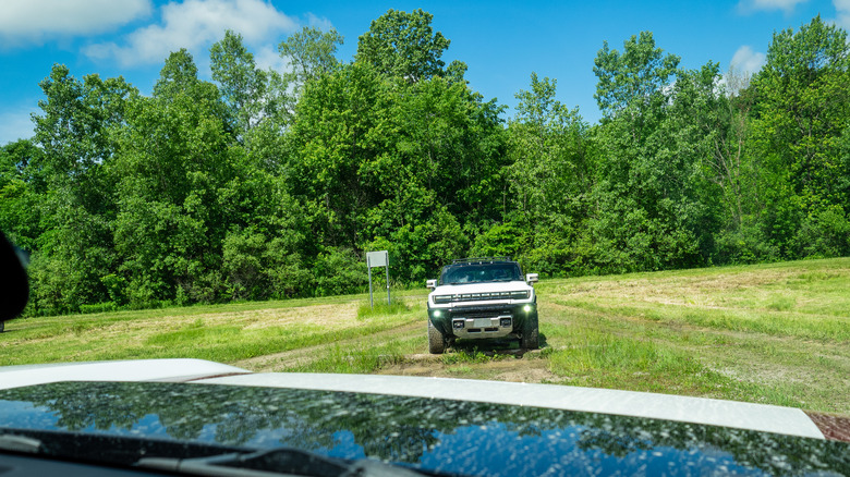 2021 GMC Hummer EV facing towards another Hummer EV