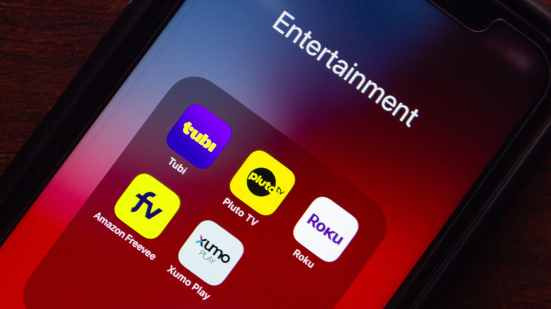 A phone showing several free ad-supported TV apps