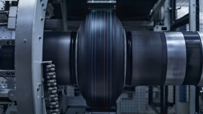 Wire being attached to a tire on a spinning machine