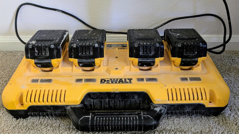 A group of DeWalt power tool batteries charging
