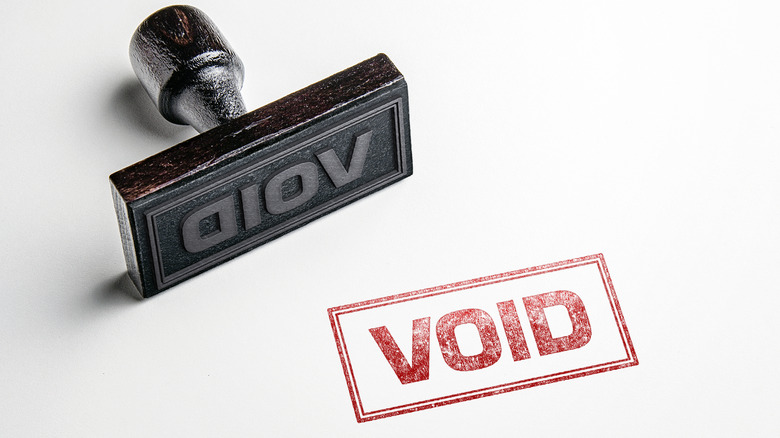 A rubber stamp showing the word "Void" in red letters