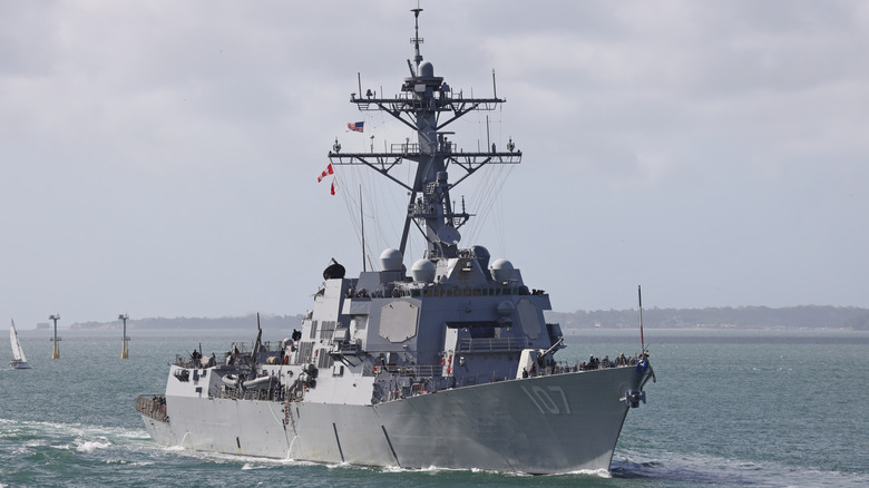 USS Gravely cruising near shoreline