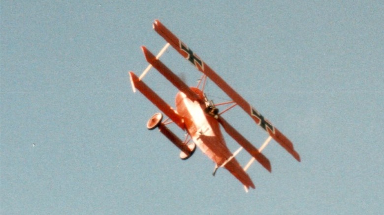 Fokker Dr. I replica in flight at a Shoreham airshow