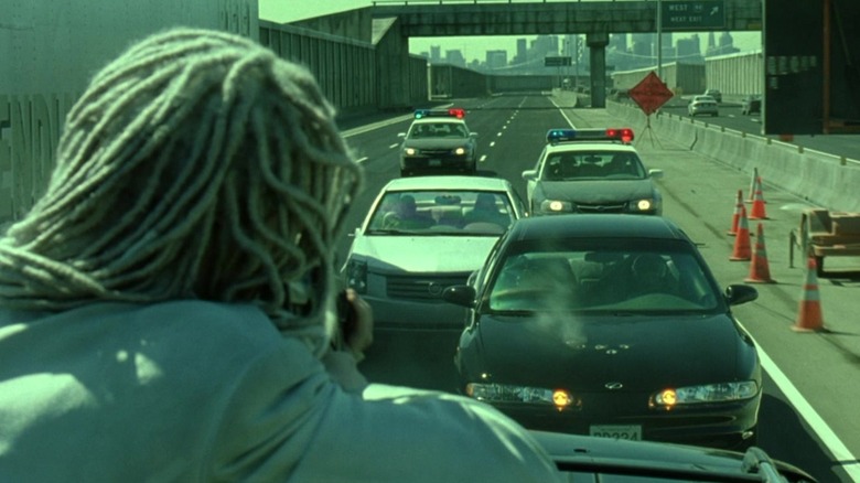 One of the Twins shoots at the Cadillac CTS in The Matrix Reloaded.