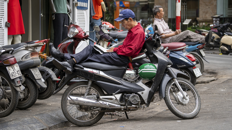 Xe-om drivers relaxing while waiting for customers.