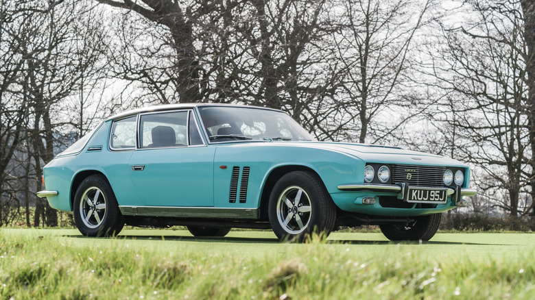 A blue Jensen FF is displayed at the Chester Classic Car Auction.