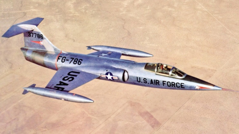 An F-104 flying over the desert