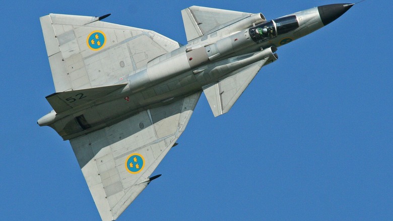 A Saab AJS-37 Viggen flying over blue skies