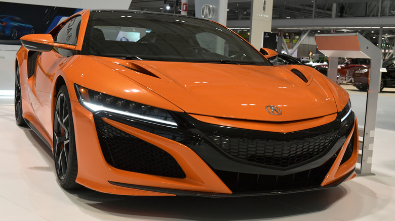 Orange Acura NSX at dealership