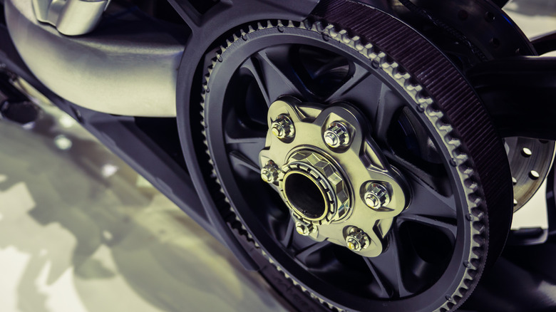 The rear wheel of a Harley-Davidson with a belt drive.