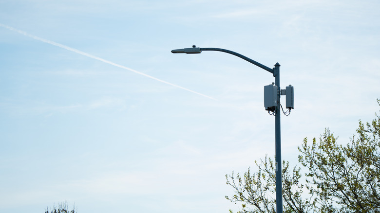 A city streetlight with 5G small cell radios mounted on its pole