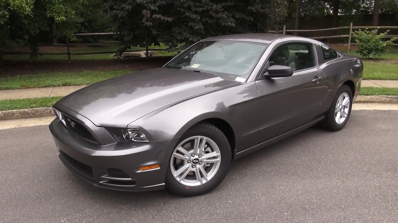 A gray 2014 Ford Mustang parked