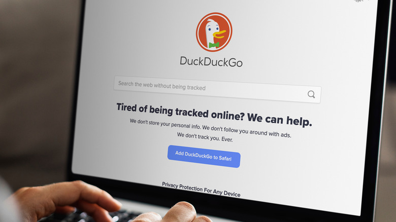 person using DuckDuckGo browser on a laptop