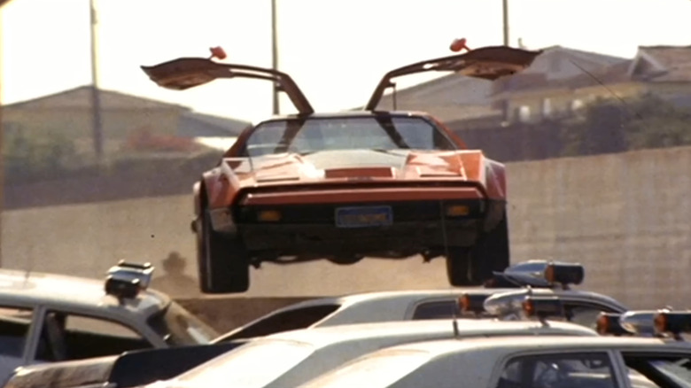 Bricklin SV-1 airborne with gullwing doors open in "The Junkman"