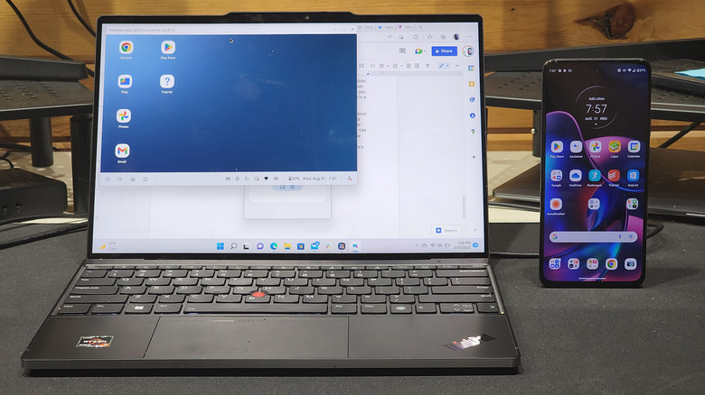 A phone next to a laptop