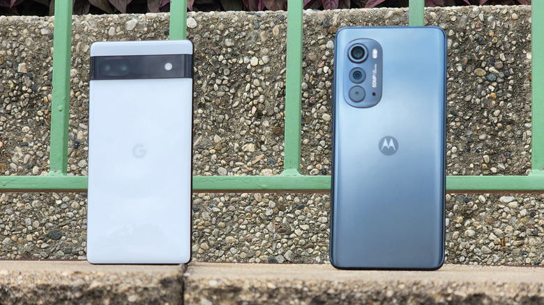 Two phones on a ledge