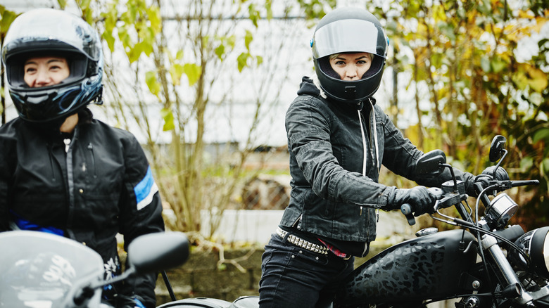 Motorcycle Riders With Helmets, Long Sleeves, Gloves, and Jeans
