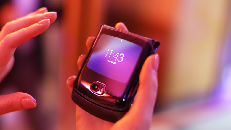 Woman using the Motorola RAZR 2020