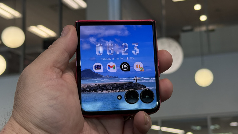 Man holding a Moto Razr Ultra