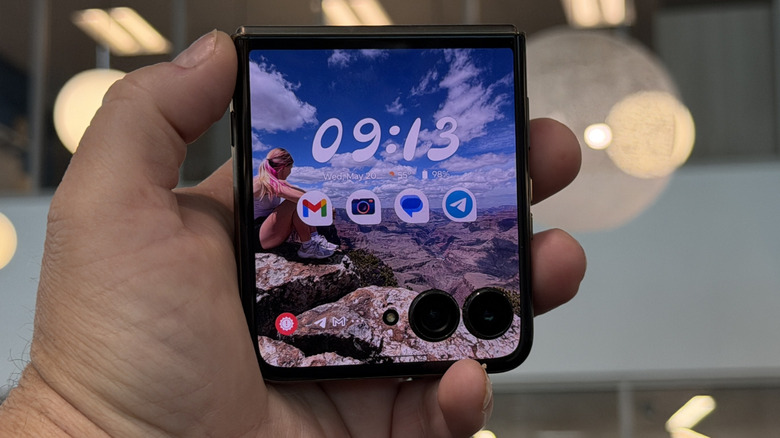 man holding the Motorola Razr Ultra