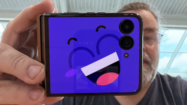 Man holding the Motorola Razr Ultra in camcorder mode