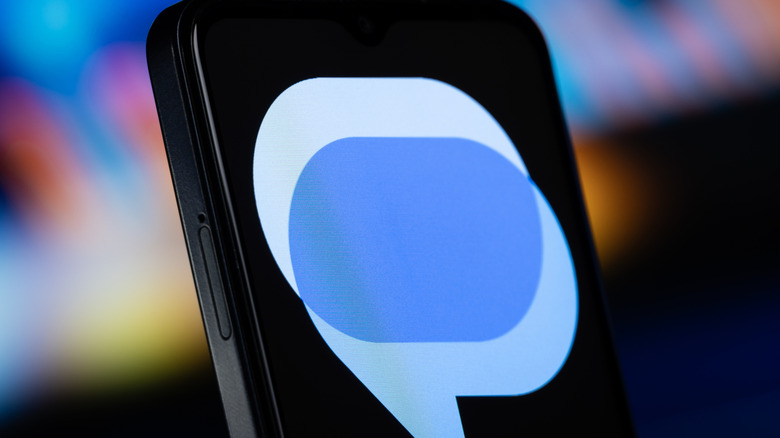 The Google Messages logo is seen on a smartphone