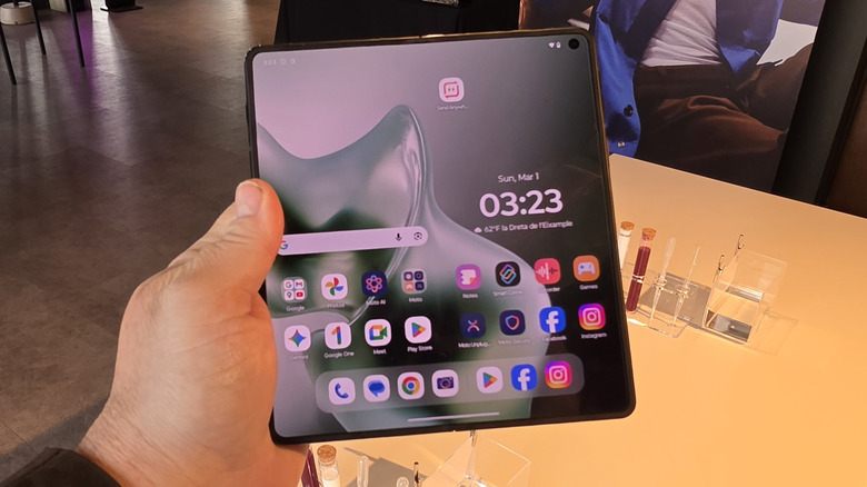 Man holding a Motorola Razr Fold