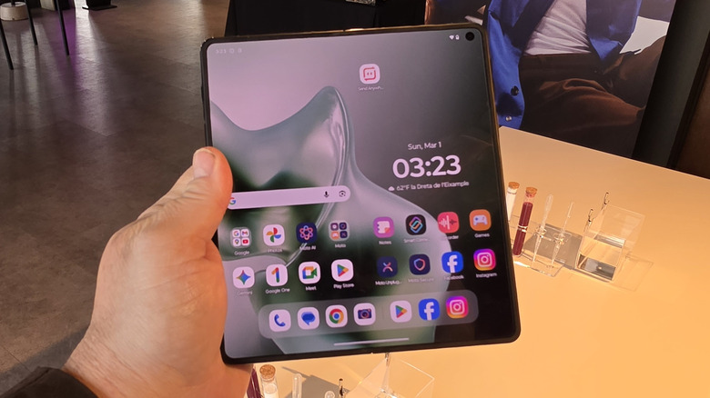 Man holding a Motorola Razr Fold