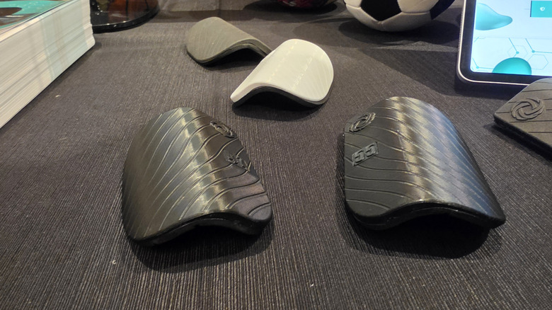 Crescento smart shin guards on a table