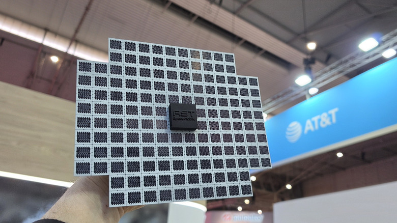 Man holding a satellite mock up